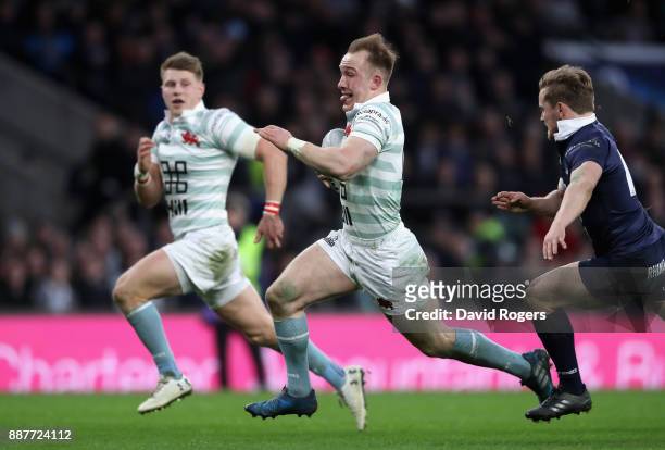Jake Hennessey of Cambridge University breaks through to score a try which is later dissalowed for a forward pass during the Oxford University vs...