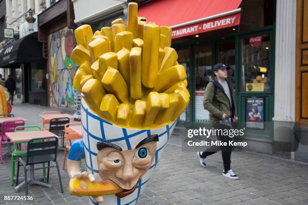 Chips character outise a Belgian frites shop in Brussels, Belgium. The Brussels-Capital Region is a region of Belgium comprising 19 municipalities,...