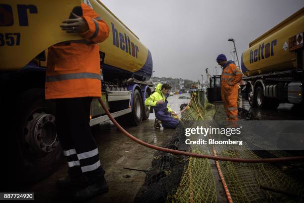 Fisherman fixes his net prior to leaving the harbor to fish at Newlyn harbour in Newlyn, U.K., on Monday, Nov. 27, 2017. Prime Minister Theresa May...