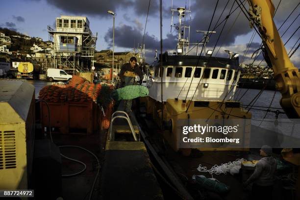 Fishermen load nets onto the St. Georges fishing trawler at sunrise in Newlyn harbor in Newlyn, U.K., on Tuesday, Nov. 28, 2017. Prime Minister...