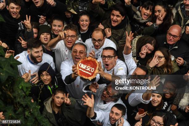 Historical center of Naples, a group of Neapolitan pizza makers celebrate the positive outcome of the UNESCO, such as «The art of Neapolitan...