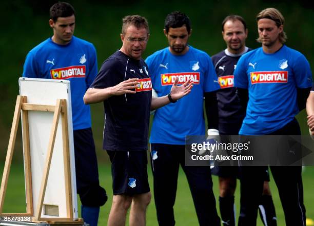 Head coach Ralf Rangnick explains as he stands next to a board during a training session of 1899 Hoffenheim during a training camp on July 1, 2009 in...