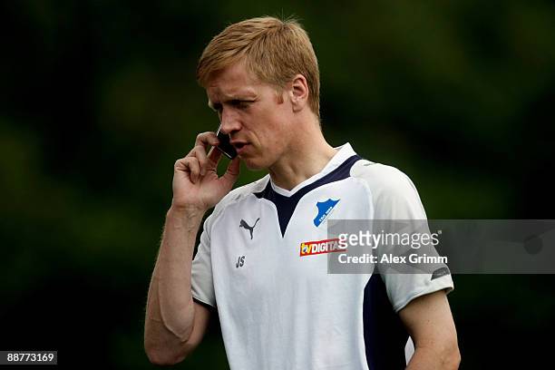 Manager Jan Schindelmeiser talks on his mobile phone during a training session of 1899 Hoffenheim during a training camp on July 1, 2009 in...