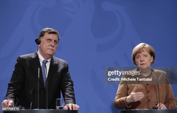 Germany Chancellor Angela Merkel and Chairman of the Presidential Council of Libya and prime minister Fayez Mustafa al-Sarraj adress the media during...