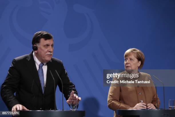 Germany Chancellor Angela Merkel and Chairman of the Presidential Council of Libya and prime minister Fayez Mustafa al-Sarraj adress the media during...