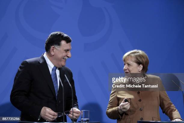 Germany Chancellor Angela Merkel and Chairman of the Presidential Council of Libya and prime minister Fayez Mustafa al-Sarraj adress the media during...