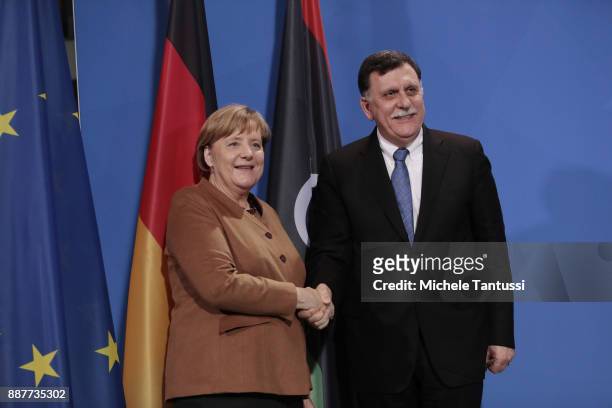 Germany Chancellor Angela Merkel and Chairman of the Presidential Council of Libya and prime minister Fayez Mustafa al-Sarraj adress the media during...