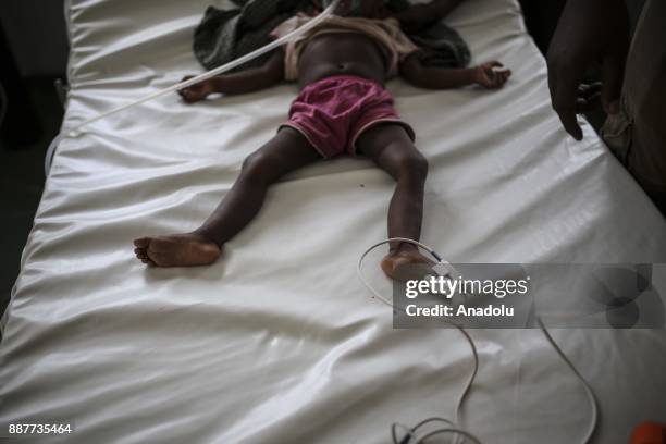 Rohingya girl, who fled from oppression within ongoing military operations in Myanmars Rakhine state, is seen as she receives medical treatments from...
