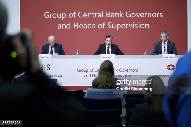 Mario Draghi, president of the European Central Bank , center, speaks as Stefan Ingves, governor of the Sveriges Riksbank and chairman of the Basel...