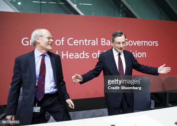 Mario Draghi, president of the European Central Bank , right, gestures as Stefan Ingves, governor of the Sveriges Riksbank and chairman of the Basel...