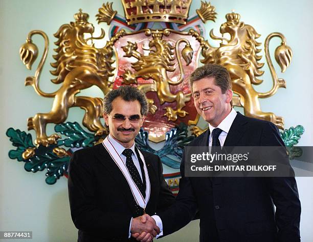 Bulgarian President Georgi Parvanov greets Saudi Prince Al-Waleed bin Talal after he was awarded with the Order of the Madara Horseman first class in...