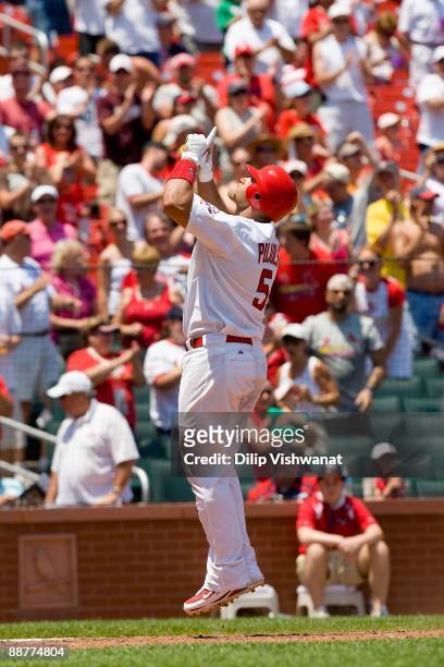 Albert Pujols of the St. Louis Cardinals celebrates after hitting a home run against the Minnesota Twins on June 27, 2009 at Busch Stadium in St....