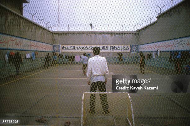 Political prisoners play football within the walls of Evin Prison in Tehran, Iran, 10th February 1986.
