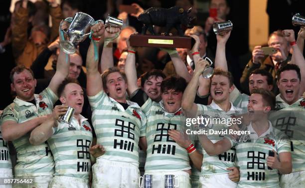 Charlie Amesbury, Captain of Cambridge University lifts the trophy following victory during the Oxford University vs Cambridge University Mens...