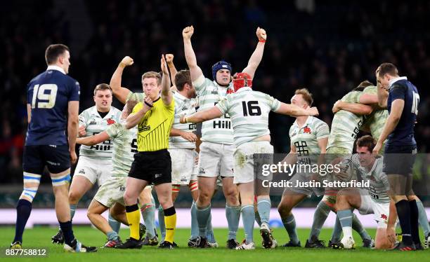 Cambridge University celebrate after winning the Mens Varsity Match between Oxford University and Cambridge University at Twickenham Stadium on...