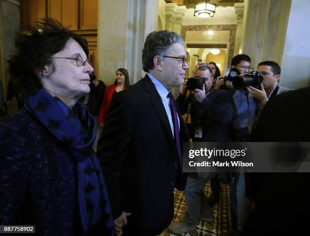 Sen. Al Franken walks with his wife Franni Bryson, to the Senate chamber to announce his resignation, Capitol Hill, on December 7, 2017 on Capitol...