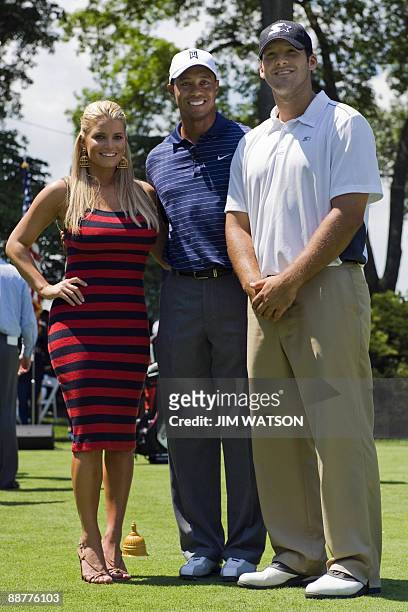 National host Tiger Woods poses with pop singer Jessica Simpson and Dallas Cowboys Quarterback Tony Romo after hitting the ceremonial first tee to...