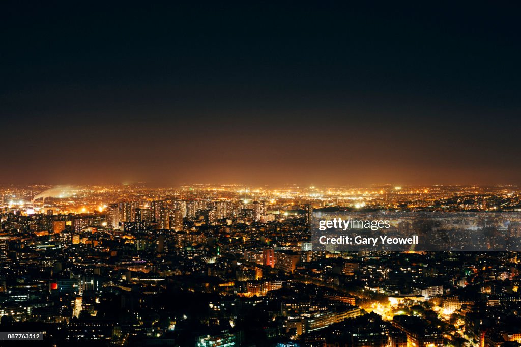 Aerial view over Paris skyline at night