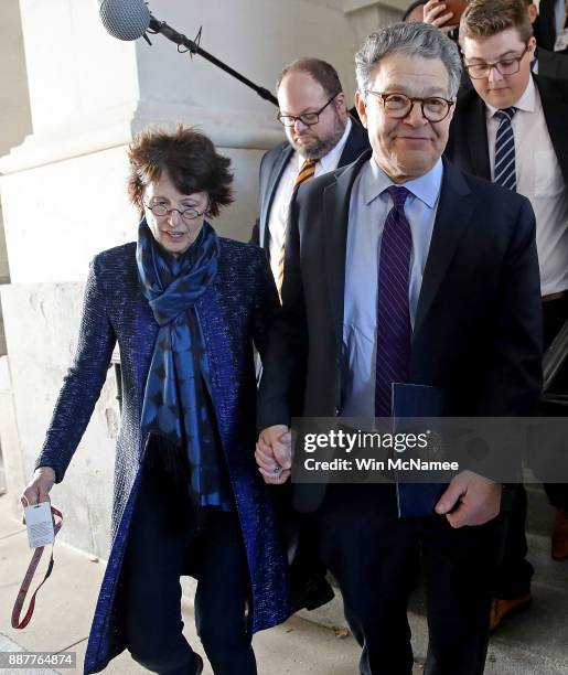 Sen. Al Franken leaves the U.S. Capitol with his wife Franni Bryson after speaking on the floor of the U.S. Senate December 7, 2017 in Washington,...