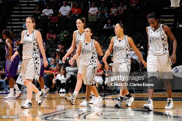 Belinda Snell, Ruth Riley, Becky Hammon, Helen Darling and Sophia Young of the San Antonio Silver Stars walk across the court during the WNBA game...