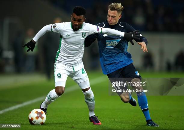 Cicinho of PFC Ludogorets Razgrad holds off pressure from Robin Hack of 1899 Hoffenheim during the UEFA Europa League group C match between 1899...