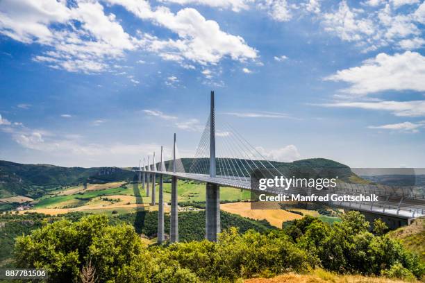 millau viaduct spans the river tarn valley - millau viaduct stock pictures, royalty-free photos & images