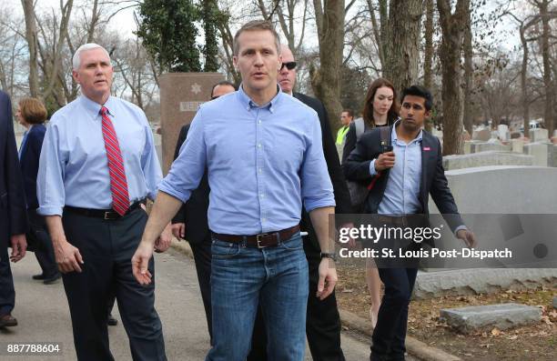 Vice President Mike Pence and Missouri Gov. Eric Greitens walk through the Chesed Shel Emeth Cemetery in University City, Mo., on Wednesday, Feb. 22...