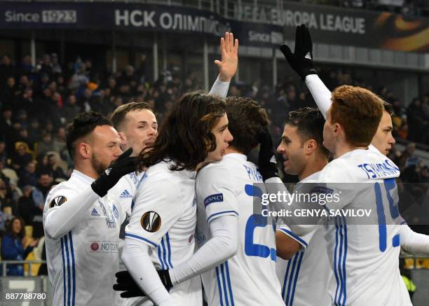 Dynamo's Mykola Morozyuk celebrates with his teammates after scoring during the UEFA Europa League group stage football match between Dynamo Kyiv and...