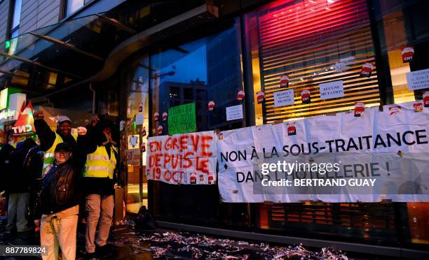 Hemera subcontractor cleaning workers demonstrate on December 7 in front of the Holiday Inn Porte de Clichy hotel in Clichy, after a 50 days strike....