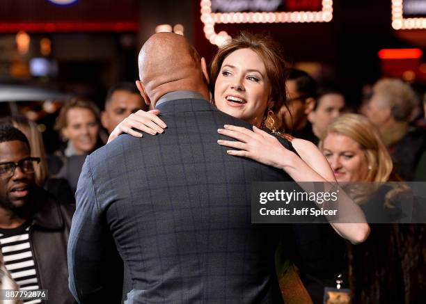 Dwayne Johnson hugs Karen Gillan at the 'Jumanji: Welcome To The Jungle' UK premiere held at Vue West End on December 7, 2017 in London, England.