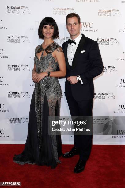 Tuba Buyukustun and IWC Schaffhausen CEO Christoph Grainger-Herr attend the sixth IWC Filmmaker Award gala dinner at the 14th Dubai International...