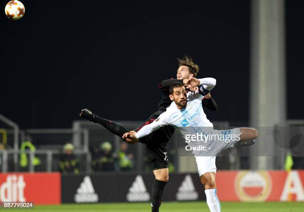 Milan midfielder Manuel Locatelli vies with Rijeka's midfielder Mate Males during the UEFA Europa League Group D football match between HNK Rijeka...