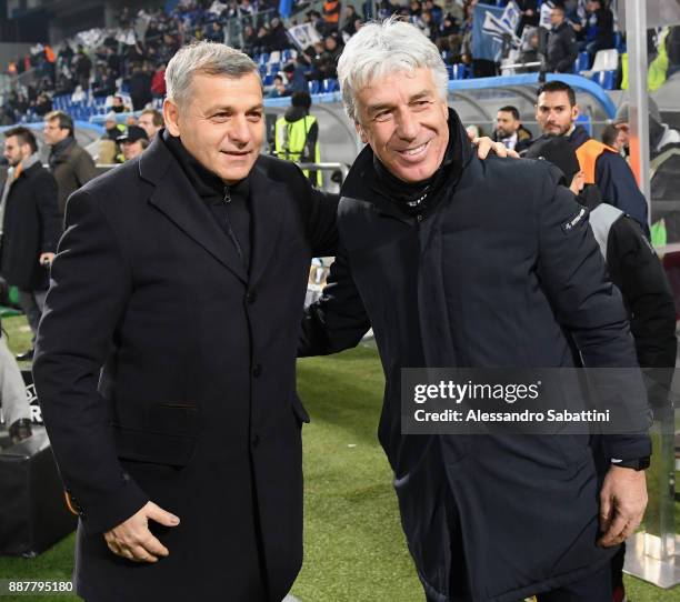 Head coach Bruno Génésio of Olympique Lyon embraces Gian Piero Gasperini head coach of Atalanta before the UEFA Europa League group E match between...