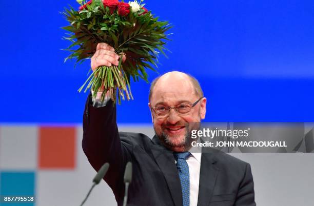 Martin Schulz, leader of Germany's social democrat SPD party, smiles after he was re-elected as party leader during the congress of the SPD on...