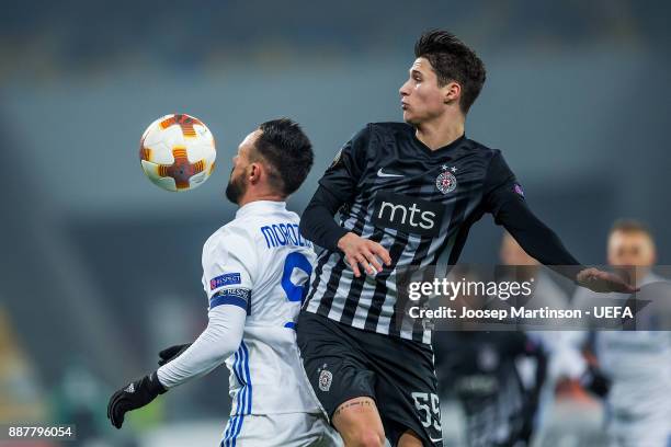 Mykola Morozyuk of FC Dynamo Kyiv competes with Danilo Pantic of FK Partizan Belgrade during the UEFA Europa League group B match between FC Dynamo...