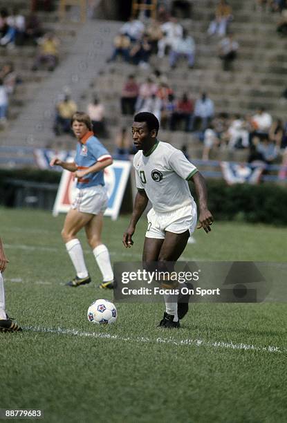 S: Soccer player Pele of the New York Cosmos dribbles the ball during a NASL soccer game mid circa 1970's at Yankee Stadium in Bronx, New York. Pele'...