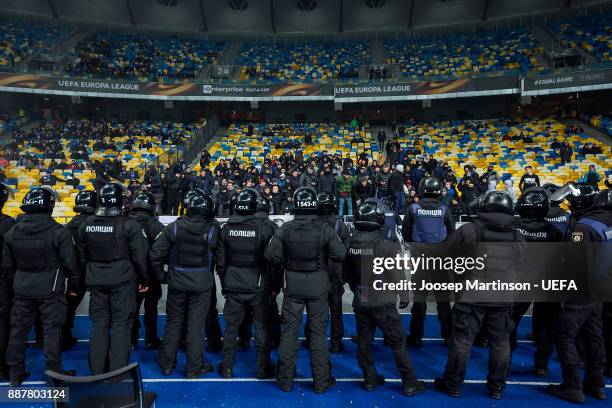 Dynamo fans chant as police looks on during the UEFA Europa League group B match between FC Dynamo Kyiv and FK Partizan Belgrade at NSK Olimpiyskyi...