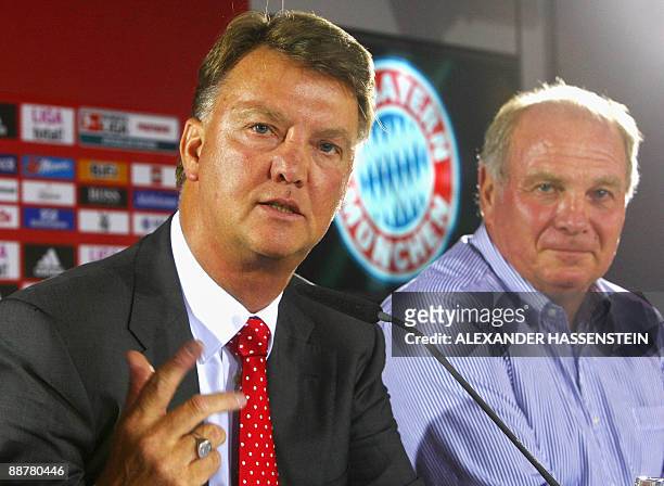 Bayern Munich's new coach Louis van Gaal addresses a press conference as Bayern Munich manager Uli Hoeness looks on after their team's first training...