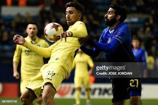 Villarreal's forward Dario Poveda challenges Maccabi Tel Aviv's defender Ofir Davidzada during the UEFA Europa League group A football match between...