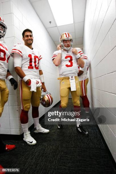 Jimmy Garoppolo and C.J. Beathard of the San Francisco 49ers stand in the hallway prior to the game against the Chicago Bears at Soldier Field on...