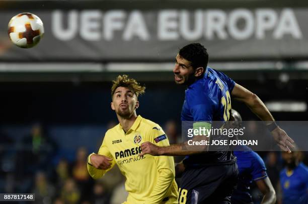 Villarreal's forward Dario Poveda challenges Maccabi Tel Aviv's defender Eytan Tibi during the UEFA Europa League group A football match between...