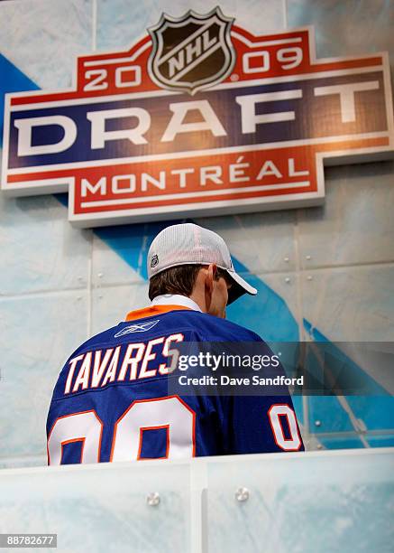 Number one overall pick of the 2009 NHL Entry Draft and the number one pick of the New York Islanders John Tavares stands in the podium area to...