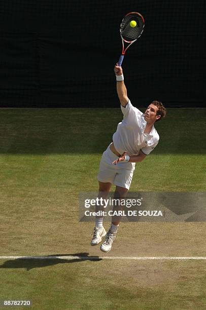 England's Andy Murray returns a ball to Spain's Juan Carlos Ferrero during their quarter final match on Day 9 at the 2009 Wimbledon tennis...