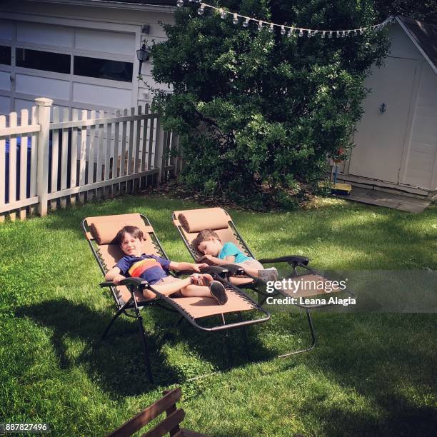 lounging in the backyard - leana alagia stockfoto's en -beelden