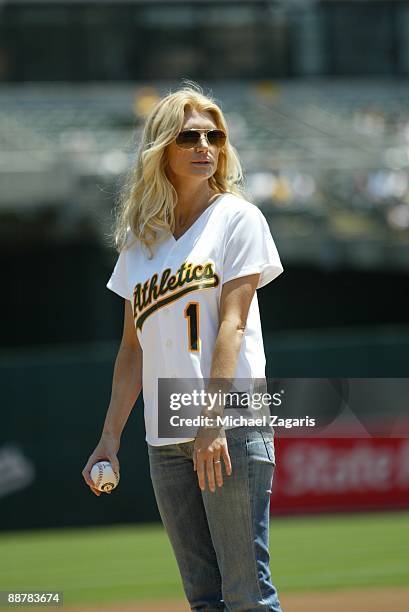 Brande Roderick from Celebrity Apprentice throws out the first pitch at the game between the Oakland Athletics and the Seattle Mariners at the...