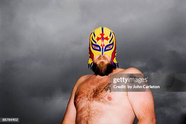 mexican wrestler in front of clouds - wrestling foto e immagini stock