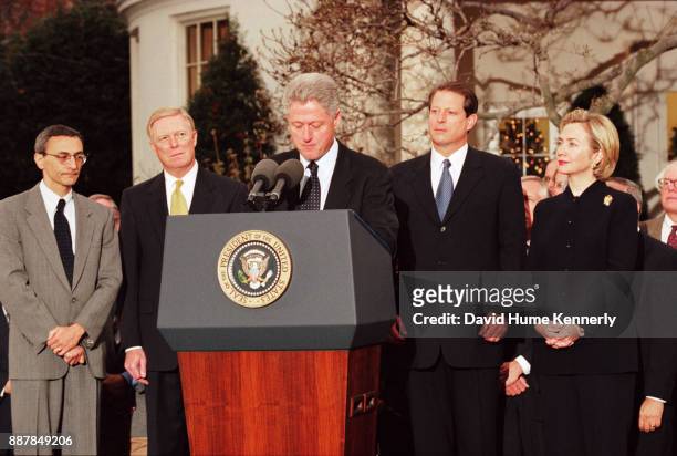 President Bill Clinton reacts to being impeached by the House of Representatives outside of the oval office in the White House Rose Garden,...