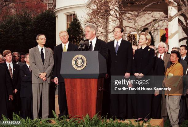Surrounded by Congressional Democrats, President Bill Clinton reacts to being impeached by the House of Representatives outside of the oval office in...