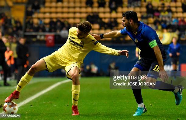 Villarreal's forward Dario Poveda challenges Maccabi Tel Aviv's defender Eytan Tibi during the UEFA Europa League group A football match between...