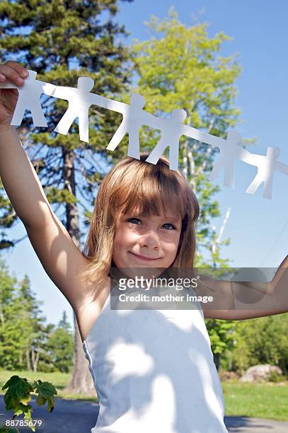 girl holding cut-outs of people holding hands - vinalhaven bildbanksfoton och bilder